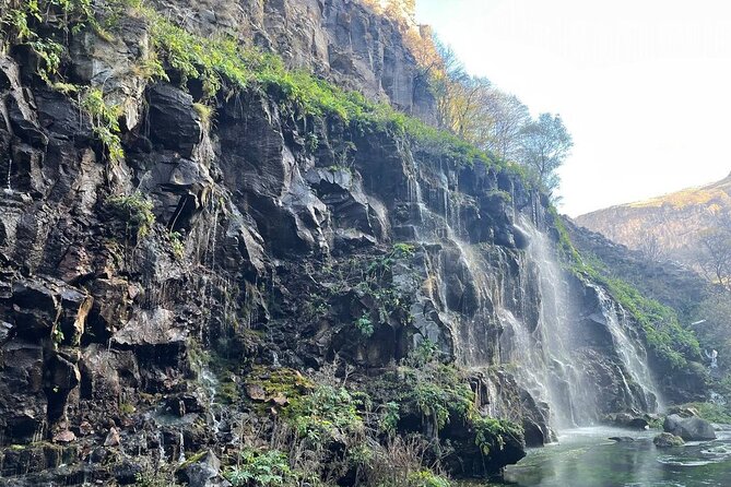 1 Day Tour in Dashbashi Canyon - Entering the canyon: glass bridge, big views, and a diamond-shaped restaurant
