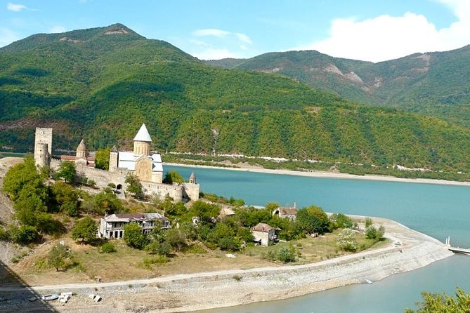 Caucasus mountains full day Private Tour Ananuri-Gudauri-Kazbegi - Zhinvali Water Reservoir: Soviet Hydro Past and the Underwater City Story