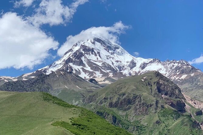 Day tour to mountains Jinvali lake, Ananuri, Kazbegi, Arch friendship - Zhinvali Dam: Turquoise Water and the Human-Made Surprise