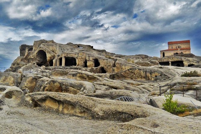 Private 5-Day Tours & Transfers from Tbilisi to Top Georgia Spots - Uplistsikhe Cave Town, walking through rock-hewn life